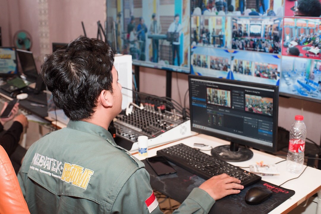 Technical directors monitoring multiple live video feeds in a broadcast control room